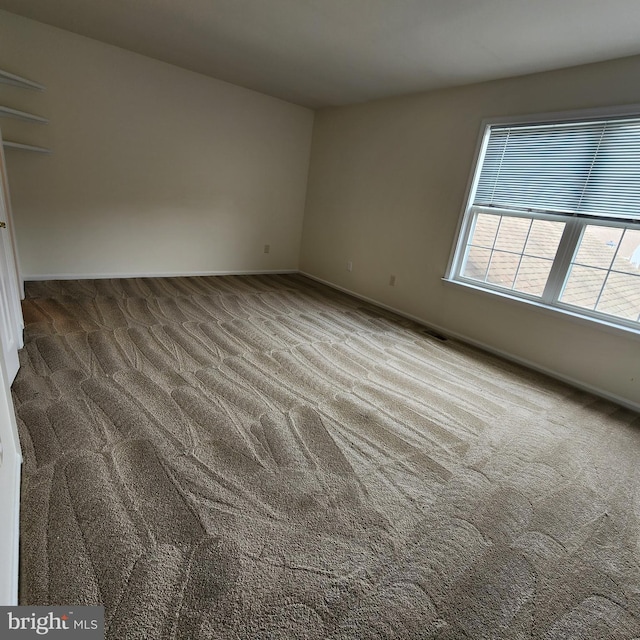 184 Steven Ln, Wilmington, DE 19808 - carpeted empty room featuring baseboards