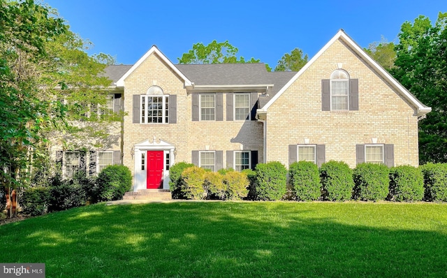 23273 Nicholson St, Hollywood, MD 20636 - colonial-style house featuring a front yard and brick siding