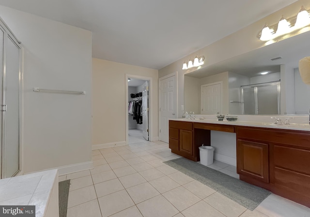 23273 Nicholson St, Hollywood, MD 20636 - full bathroom with a stall shower, double vanity, tile patterned floors, and a spacious closet