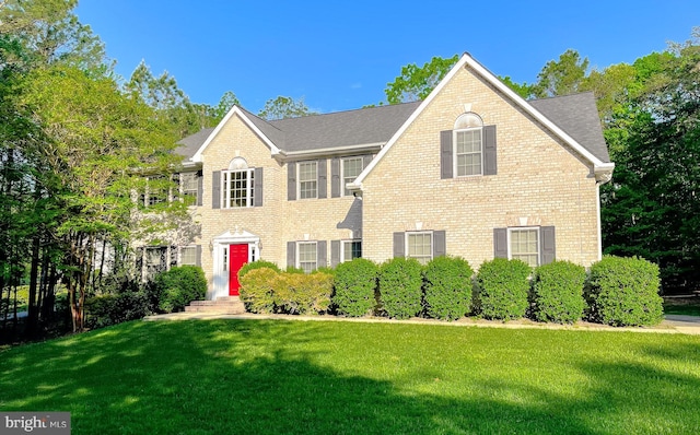 23273 Nicholson St, Hollywood, MD 20636 - colonial-style house featuring a front yard and brick siding