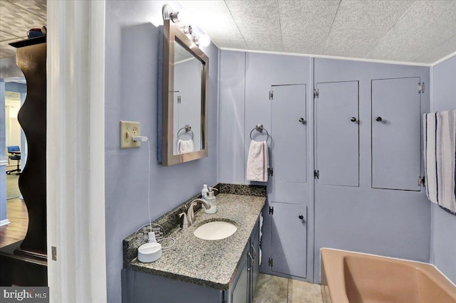 325 Summit Ave, Reading, PA 19607 - bathroom with vanity, a tub to relax in, and crown molding