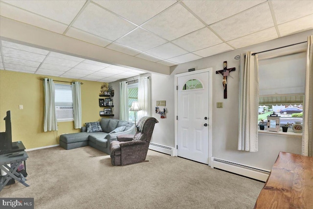 325 Summit Ave, Reading, PA 19607 - living area featuring baseboard heating, a drop ceiling, plenty of natural light, and carpet flooring