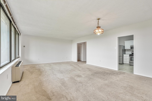 3701 S George Mason Dr Unit 611N, Falls Church, VA 22041 - unfurnished living room featuring radiator and light carpet