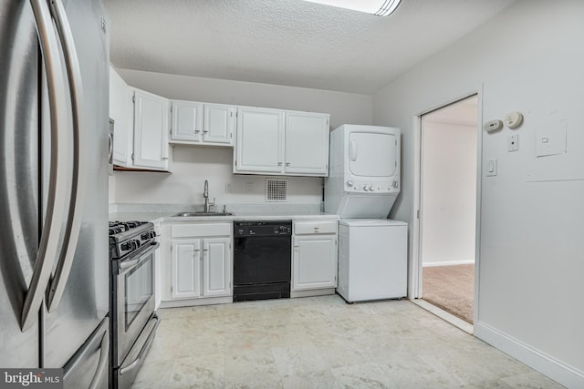 3701 S George Mason Dr Unit 611N, Falls Church, VA 22041 - kitchen featuring appliances with stainless steel finishes, stacked washer / dryer, light countertops, white cabinets, and a textured ceiling