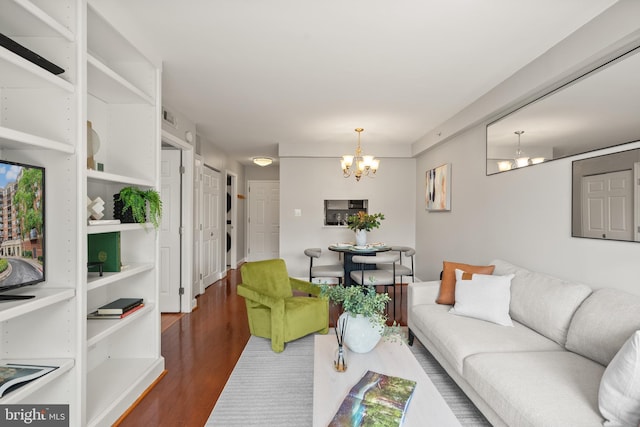 3401 38th St NW Unit 411, Washington, DC 20016 - living area featuring a chandelier and wood finished floors