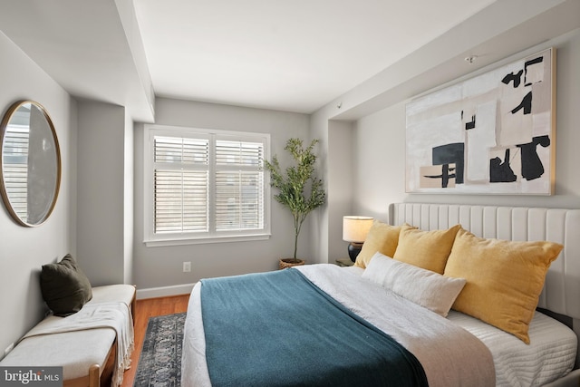 3401 38th St NW Unit 411, Washington, DC 20016 - bedroom with wood finished floors and multiple windows