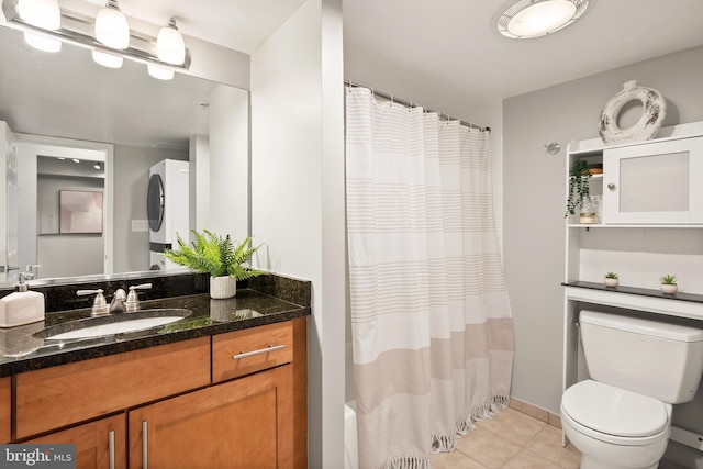 3401 38th St NW Unit 411, Washington, DC 20016 - full bathroom with stacked washer and clothes dryer, tile patterned flooring, vanity, and curtained shower