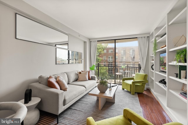 3401 38th St NW Unit 411, Washington, DC 20016 - living room featuring wood finished floors