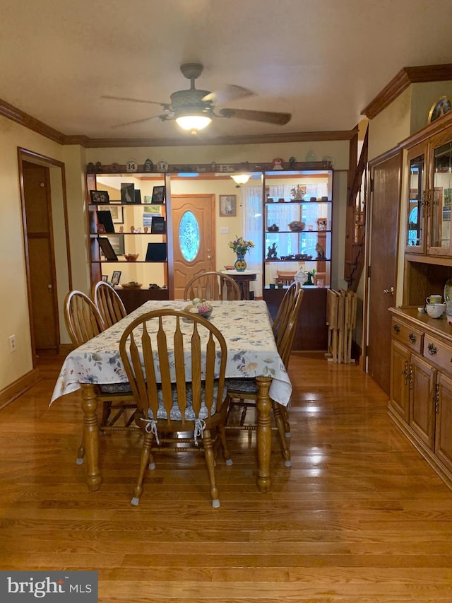 554 Locust St, Bristol, PA 19007 - dining room with crown molding, light wood-style floors, and a ceiling fan