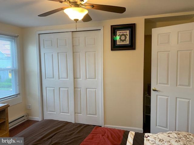 554 Locust St, Bristol, PA 19007 - bedroom featuring a baseboard radiator, a closet, a ceiling fan, and dark wood-style flooring