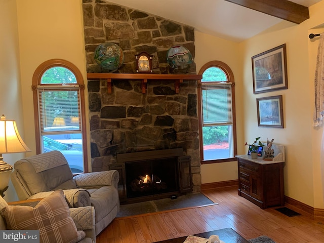 554 Locust St, Bristol, PA 19007 - living area featuring hardwood / wood-style floors, plenty of natural light, and a stone fireplace