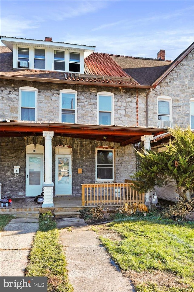 18 Belview Ave, Hagerstown, MD 21742 - townhome / multi-family property featuring stone siding, a porch, and a chimney