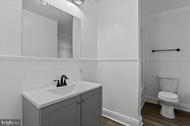 18 Belview Ave, Hagerstown, MD 21742 - bathroom with vanity, wood finished floors, a wainscoted wall, and tub / shower combination