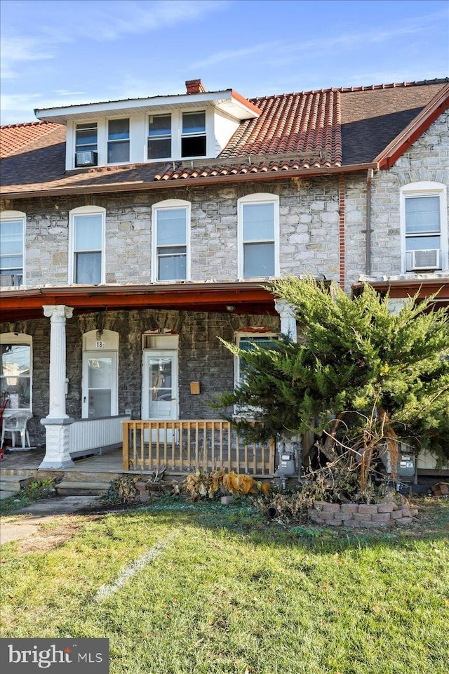 18 Belview Ave, Hagerstown, MD 21742 - view of property with stone siding, a porch, a front lawn, and cooling unit