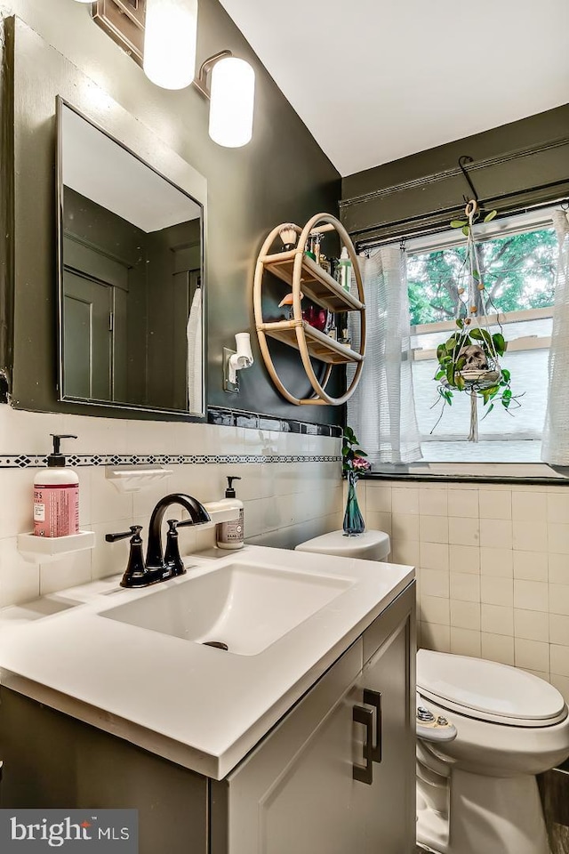 15 Willowbrook Ave, Lansdowne, PA 19050 - bathroom with tile walls, vanity, and decorative backsplash