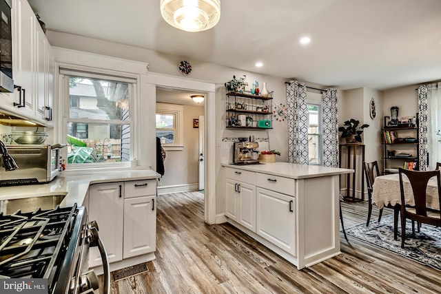 15 Willowbrook Ave, Lansdowne, PA 19050 - kitchen featuring light wood-style flooring, white cabinetry, light countertops, recessed lighting, and open shelves