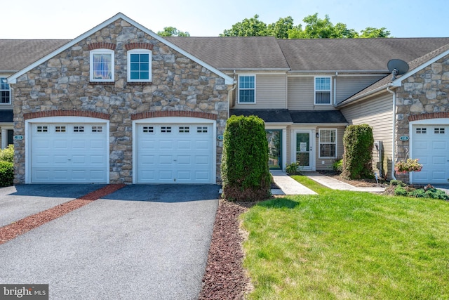 121 Westpoint Dr, Carlisle, PA 17013 - townhome / multi-family property with stone siding, asphalt driveway, and a front lawn