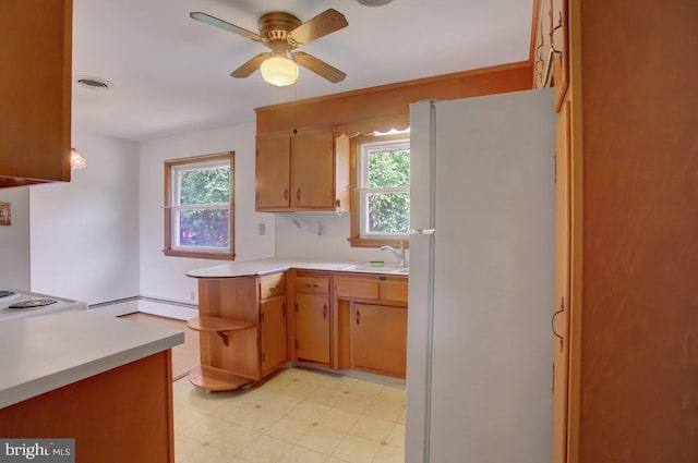 21024 Jefferson Blvd, Smithsburg, MD 21783 - kitchen with freestanding refrigerator, light countertops, and healthy amount of natural light