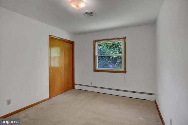 21024 Jefferson Blvd, Smithsburg, MD 21783 - empty room featuring a baseboard heating unit and light carpet