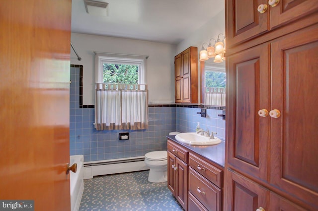 21024 Jefferson Blvd, Smithsburg, MD 21783 - full bath featuring baseboard heating, vanity, shower / bathtub combination, tile walls, and tile patterned flooring