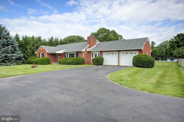 21024 Jefferson Blvd, Smithsburg, MD 21783 - view of front of property featuring asphalt driveway, an attached garage, brick siding, a front lawn, and a chimney