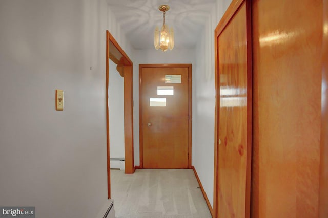 21024 Jefferson Blvd, Smithsburg, MD 21783 - hallway with a baseboard heating unit, a chandelier, and light colored carpet