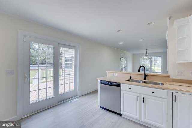 24750 Peterkins Rd, Georgetown, DE 19947 - kitchen with stainless steel dishwasher, white cabinetry, light wood-style flooring, light countertops, and recessed lighting