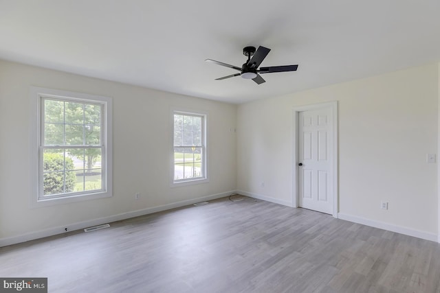 24750 Peterkins Rd, Georgetown, DE 19947 - empty room featuring a ceiling fan and light wood-style floors