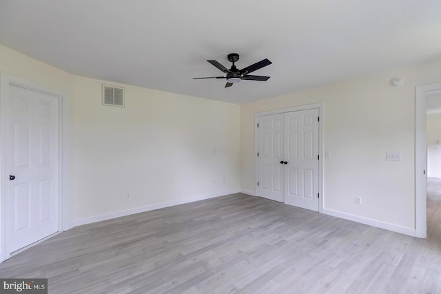 24750 Peterkins Rd, Georgetown, DE 19947 - unfurnished bedroom with light wood-style flooring, a closet, and ceiling fan