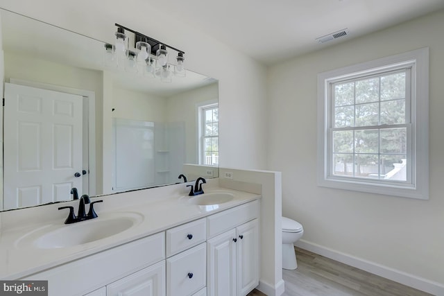 24750 Peterkins Rd, Georgetown, DE 19947 - bathroom with wood finished floors, double vanity, and a shower
