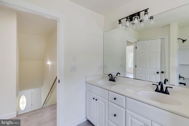 24750 Peterkins Rd, Georgetown, DE 19947 - full bath featuring double vanity and wood finished floors