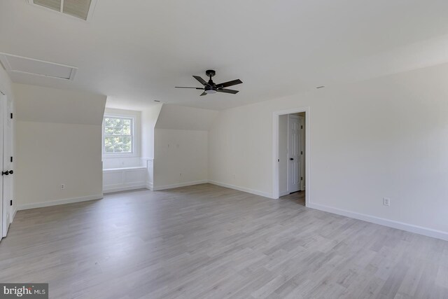24750 Peterkins Rd, Georgetown, DE 19947 - additional living space with ceiling fan, light wood-style flooring, vaulted ceiling, and attic access