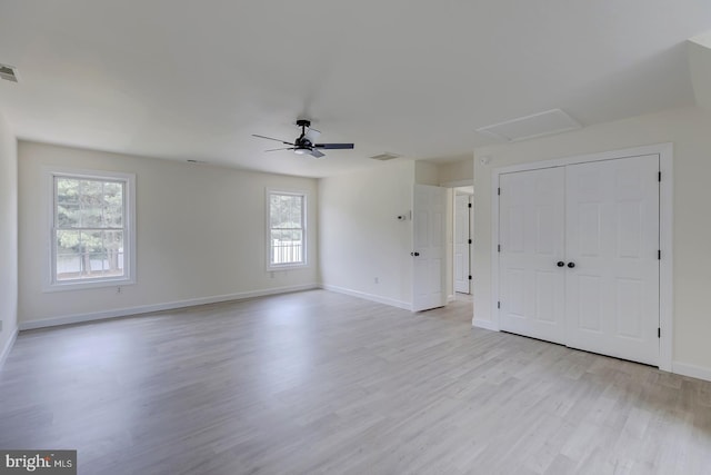 24750 Peterkins Rd, Georgetown, DE 19947 - unfurnished bedroom featuring light wood-style flooring, attic access, and a ceiling fan