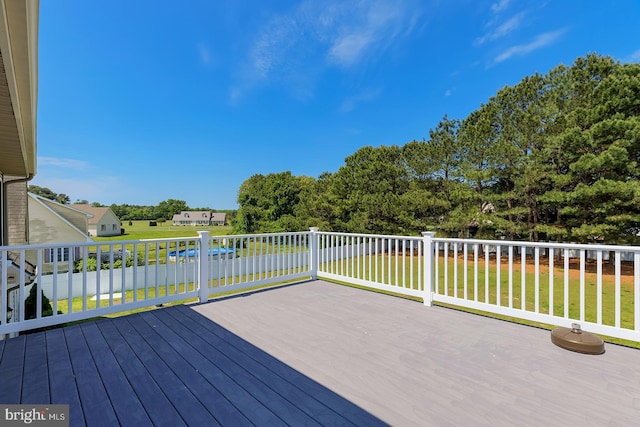 24750 Peterkins Rd, Georgetown, DE 19947 - wooden deck featuring a lawn