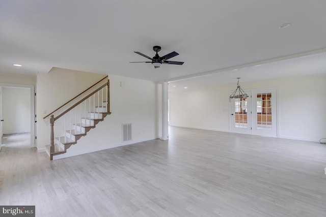 24750 Peterkins Rd, Georgetown, DE 19947 - unfurnished living room featuring wood finished floors, ceiling fan, stairs, and recessed lighting