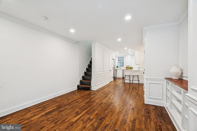 1935 S Hemberger St, Philadelphia, PA 19145 - living room with stairway, dark wood-type flooring, ornamental molding, and recessed lighting