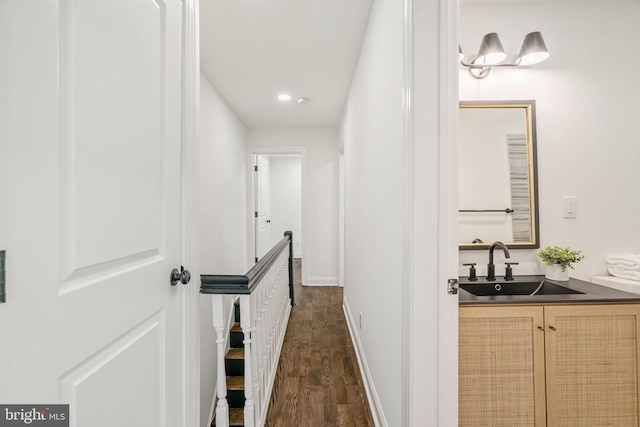 1935 S Hemberger St, Philadelphia, PA 19145 - hall with dark wood-style floors, an upstairs landing, and recessed lighting
