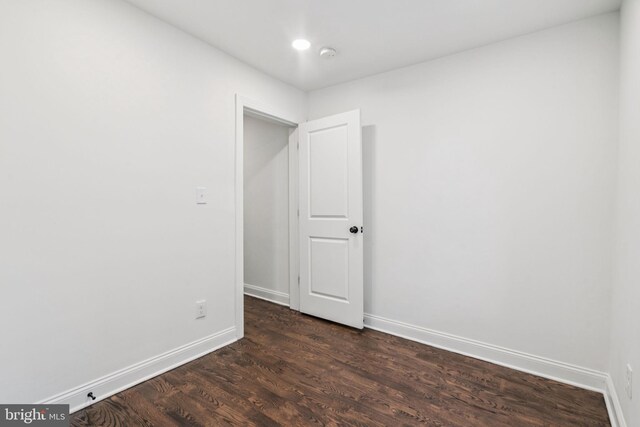 1935 S Hemberger St, Philadelphia, PA 19145 - empty room with dark wood-style floors and a smoke detector