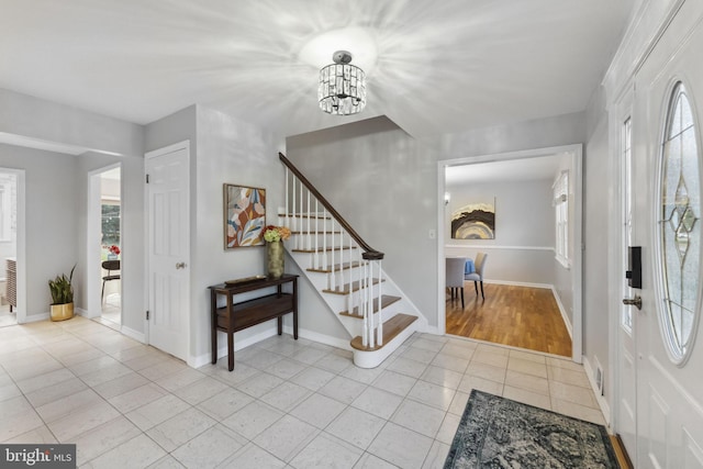 12 Stonelea Dr, Princeton Junction, NJ 08550 - entrance foyer featuring light tile patterned floors, stairs, and a chandelier