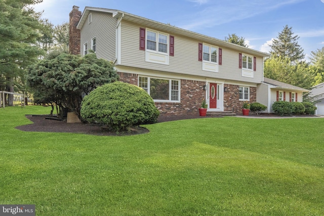 12 Stonelea Dr, Princeton Junction, NJ 08550 - colonial home featuring a chimney, a front yard, and brick siding