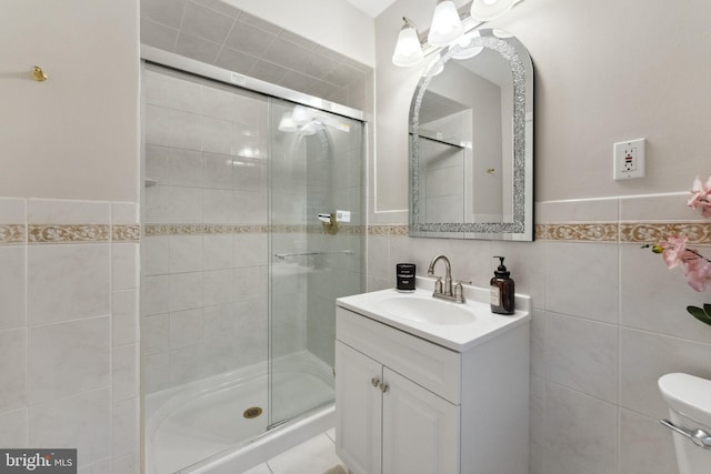 12 Stonelea Dr, Princeton Junction, NJ 08550 - bathroom with tile walls, a shower stall, vanity, and a wainscoted wall
