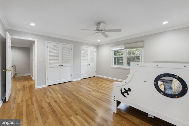 12 Stonelea Dr, Princeton Junction, NJ 08550 - unfurnished bedroom featuring two closets, recessed lighting, light wood-style flooring, crown molding, and a ceiling fan