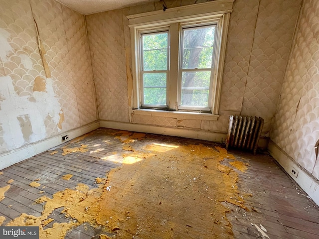1510 Baird Blvd, Camden, NJ 08103 - spare room with radiator heating unit and wallpapered walls