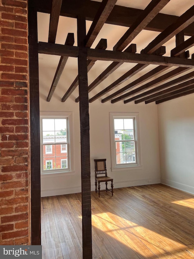 525 Scott St, Baltimore, MD 21230 - empty room with beamed ceiling, plenty of natural light, and hardwood / wood-style floors