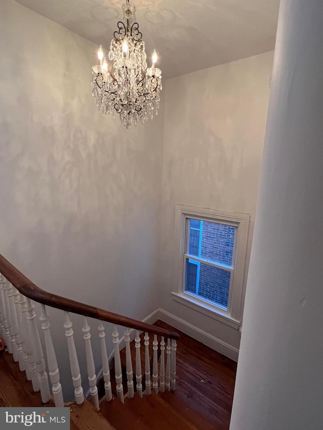 525 Scott St, Baltimore, MD 21230 - staircase featuring wood finished floors and a chandelier