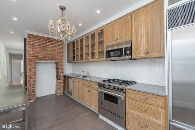 525 Scott St, Baltimore, MD 21230 - kitchen with high quality appliances, a chandelier, glass insert cabinets, dark wood-style floors, and backsplash