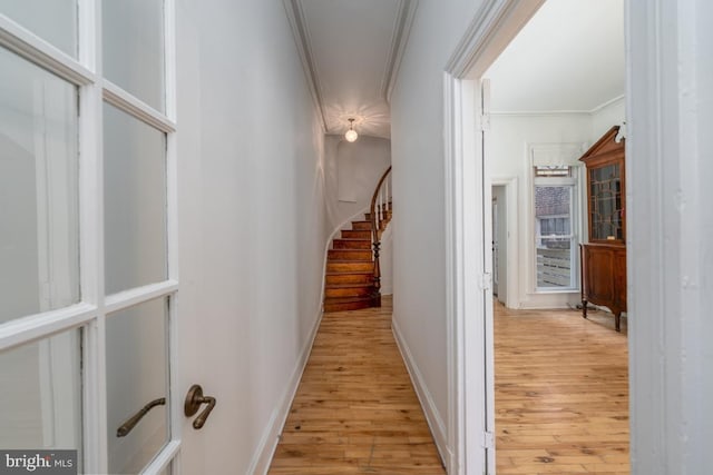 525 Scott St, Baltimore, MD 21230 - hallway featuring light wood-style flooring, ornamental molding, and stairs