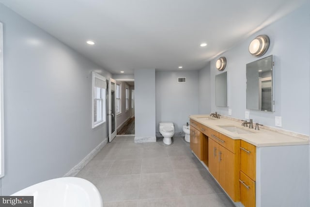 525 Scott St, Baltimore, MD 21230 - full bath with a bidet, recessed lighting, double vanity, tile patterned floors, and a freestanding bath