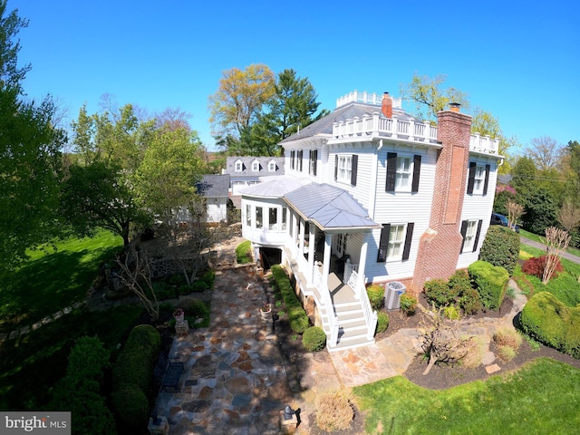 3634 Chain Bridge Rd, Fairfax, VA 22030 - view of front of property with stairway, a chimney, and a balcony