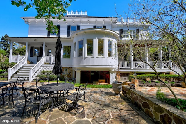 3634 Chain Bridge Rd, Fairfax, VA 22030 - rear view of house with stairs, a patio, outdoor dining area, and a ceiling fan